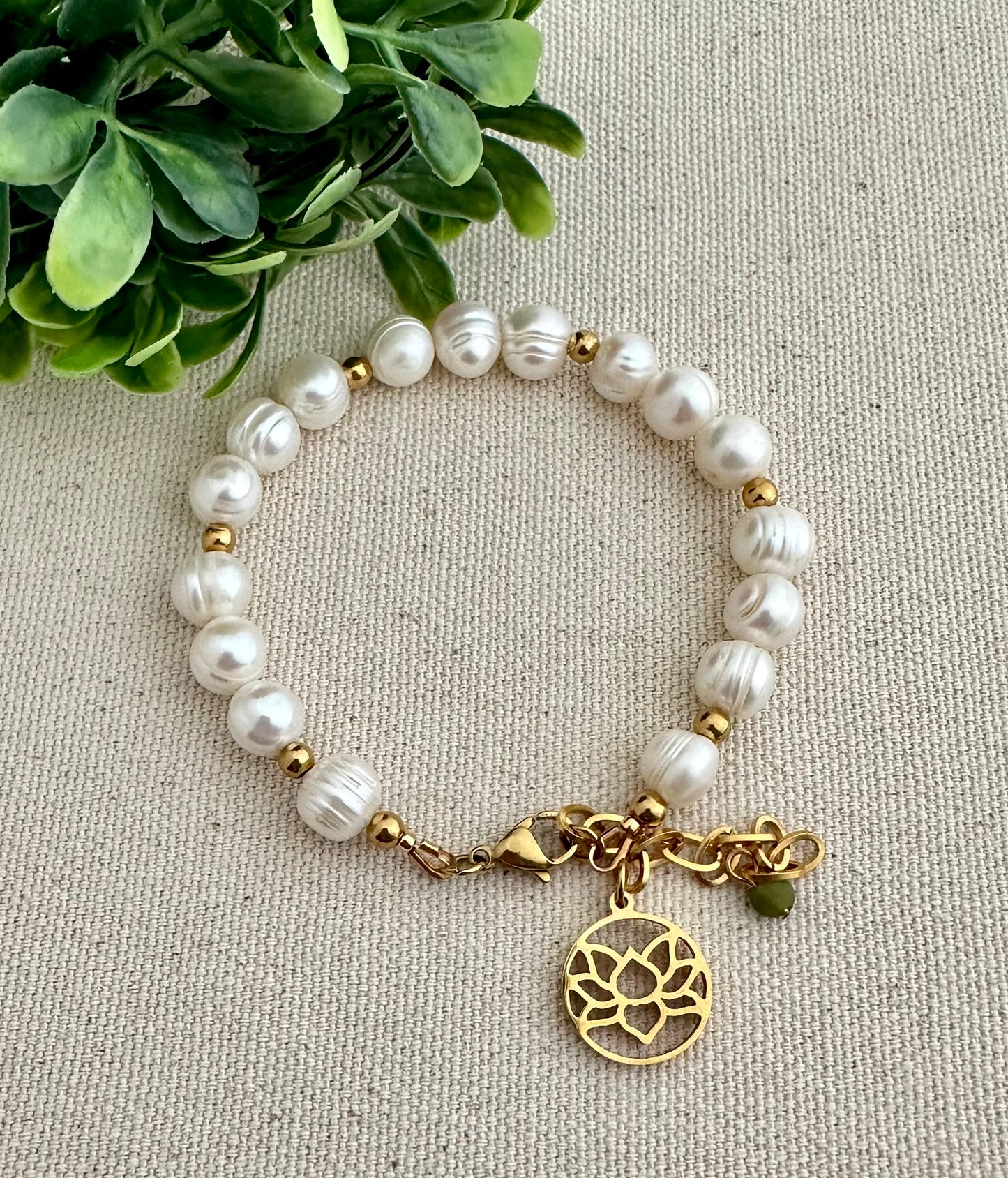 Beautiful pearls bracelet with lotus flower charm. Bracelets with meaning.