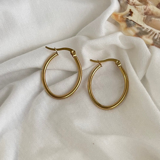 These elegant Gold Oval Hoop Earrings are expertly crafted from hypoallergenic 18k stainless steel, making them the perfect choice for those with sensitive skin.