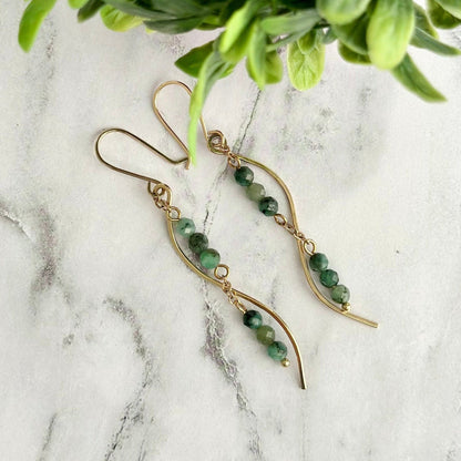 Delicate Earrings made with African Emerald faceted  14K gold filled ear hook  14k gold filled chain & hammered wire  2 3/4 inches length