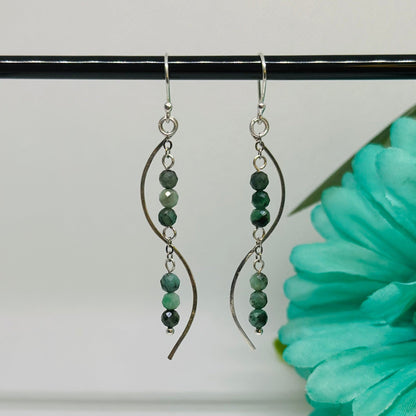 The premium materials make these earrings durable and long-lasting, so you can be sure they're always looking their very best.  African Emerald faceted  925 Sterling Silver ear hook  925 Sterling Silver chain & hammered wire  2 3/4 inches length