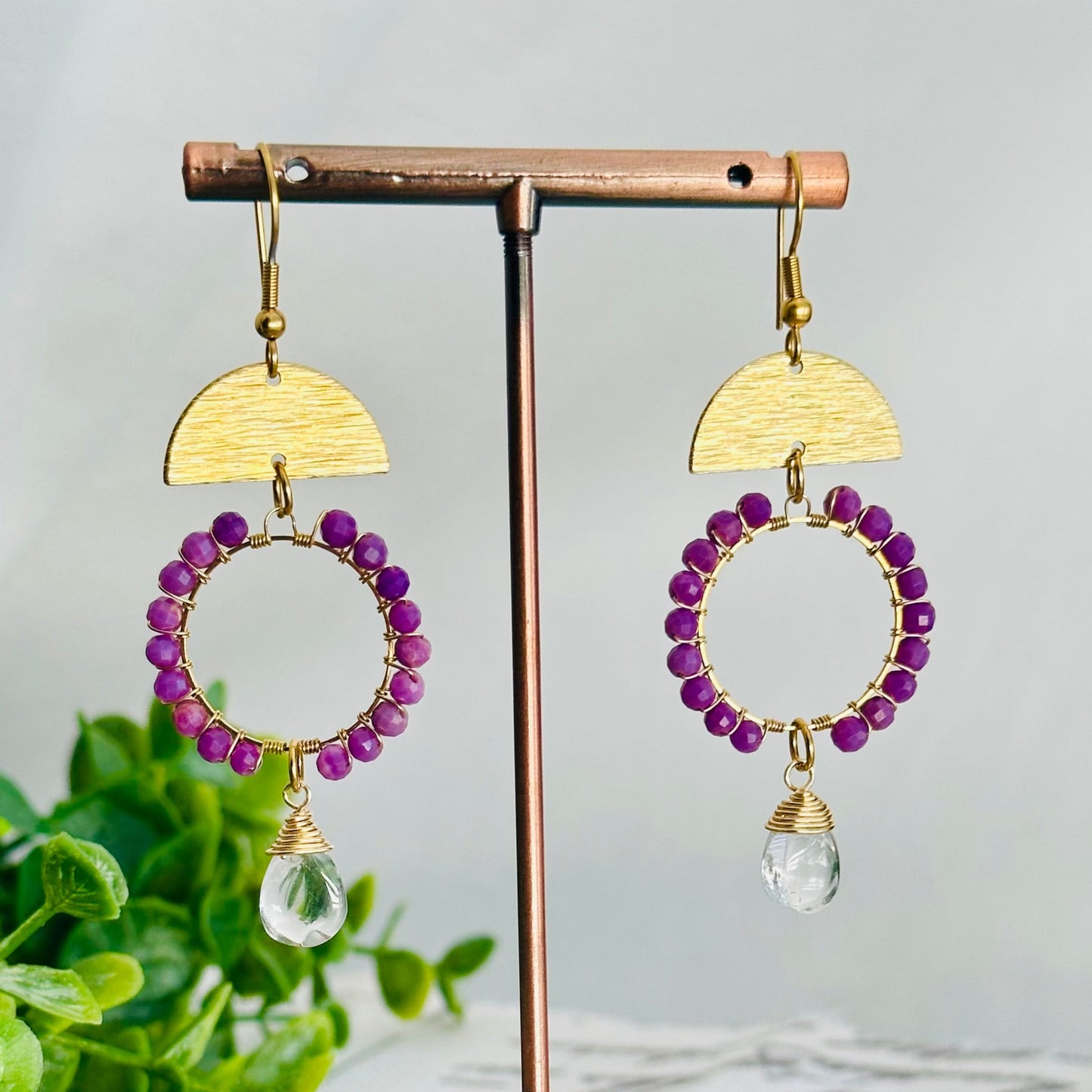 Beautiful Purple Phosphosiderite beads combine with a Prasolite teardrop and half-moon brass link.