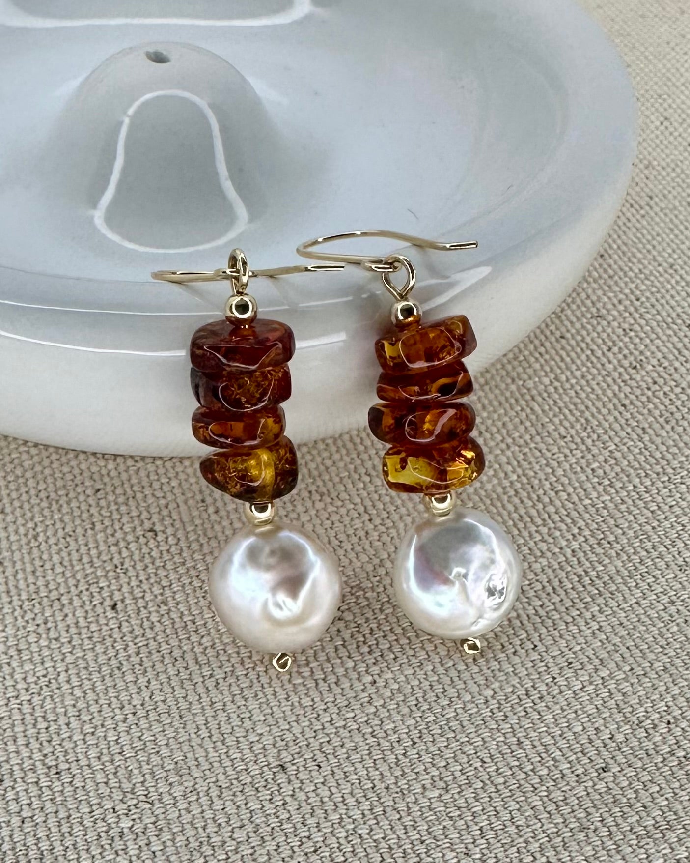 Sophisticated Baltic ambar dangle earrings with a coin shape freshwater pearl.