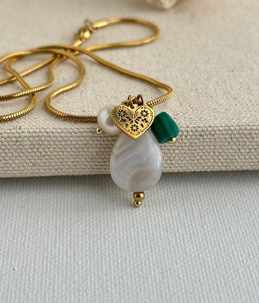 Beautiful pendant, look how they glow here when combined with heart charm, malachite and freshwater pearl.