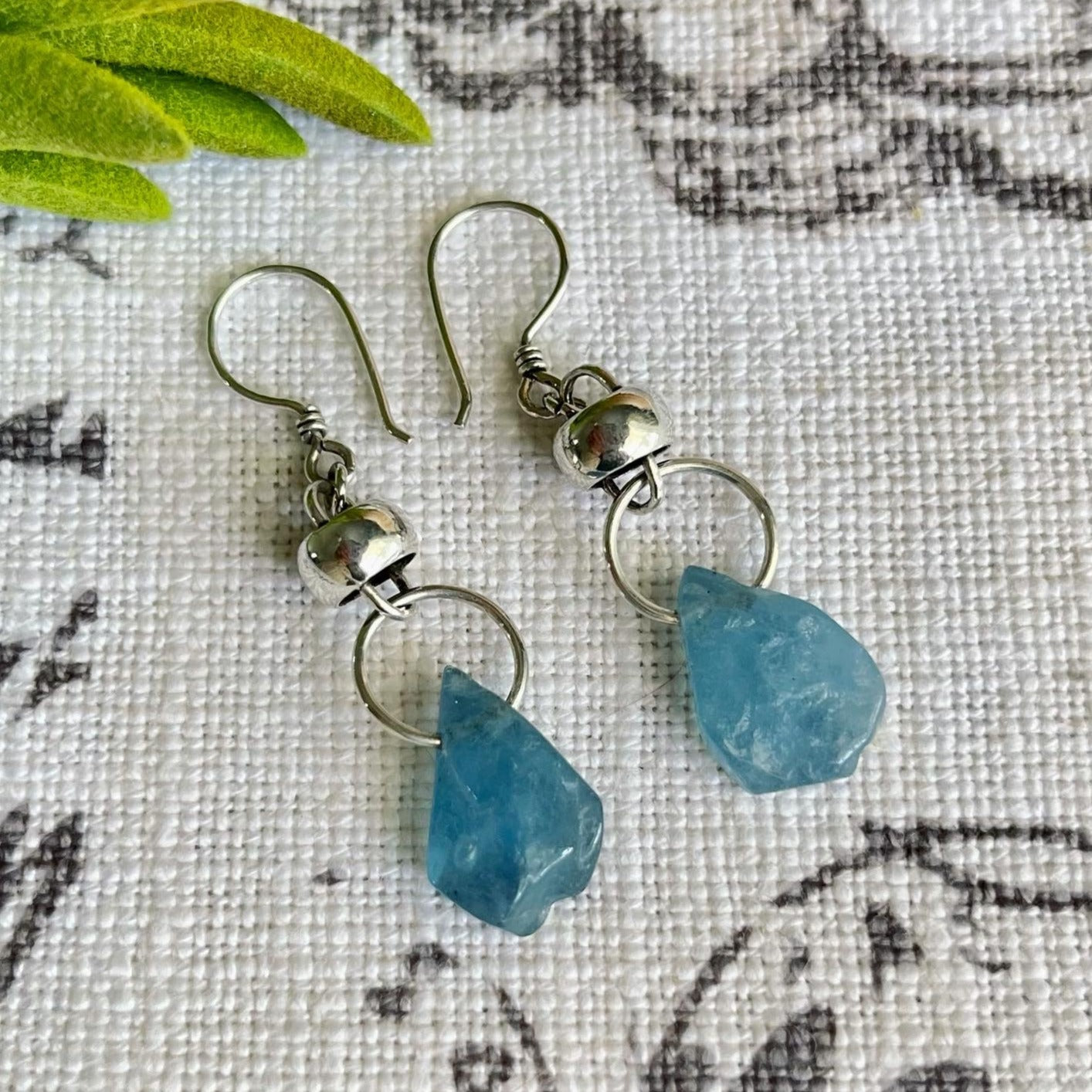 Our Baby Blue Earrings are a unique and stylish addition to any jewelry collection. Boasting an one-of-a-kind aquamarine teardrop, this eye-catching earrings is the perfect way to make a statement. Crafted to the highest quality of 950 Sterling Silver.