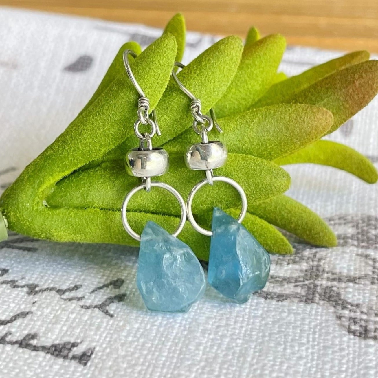 Our Baby Blue Earrings are a unique and stylish addition to any jewelry collection. Boasting an one-of-a-kind aquamarine teardrop, this eye-catching earrings is the perfect way to make a statement. Crafted to the highest quality of 950 Sterling Silver.